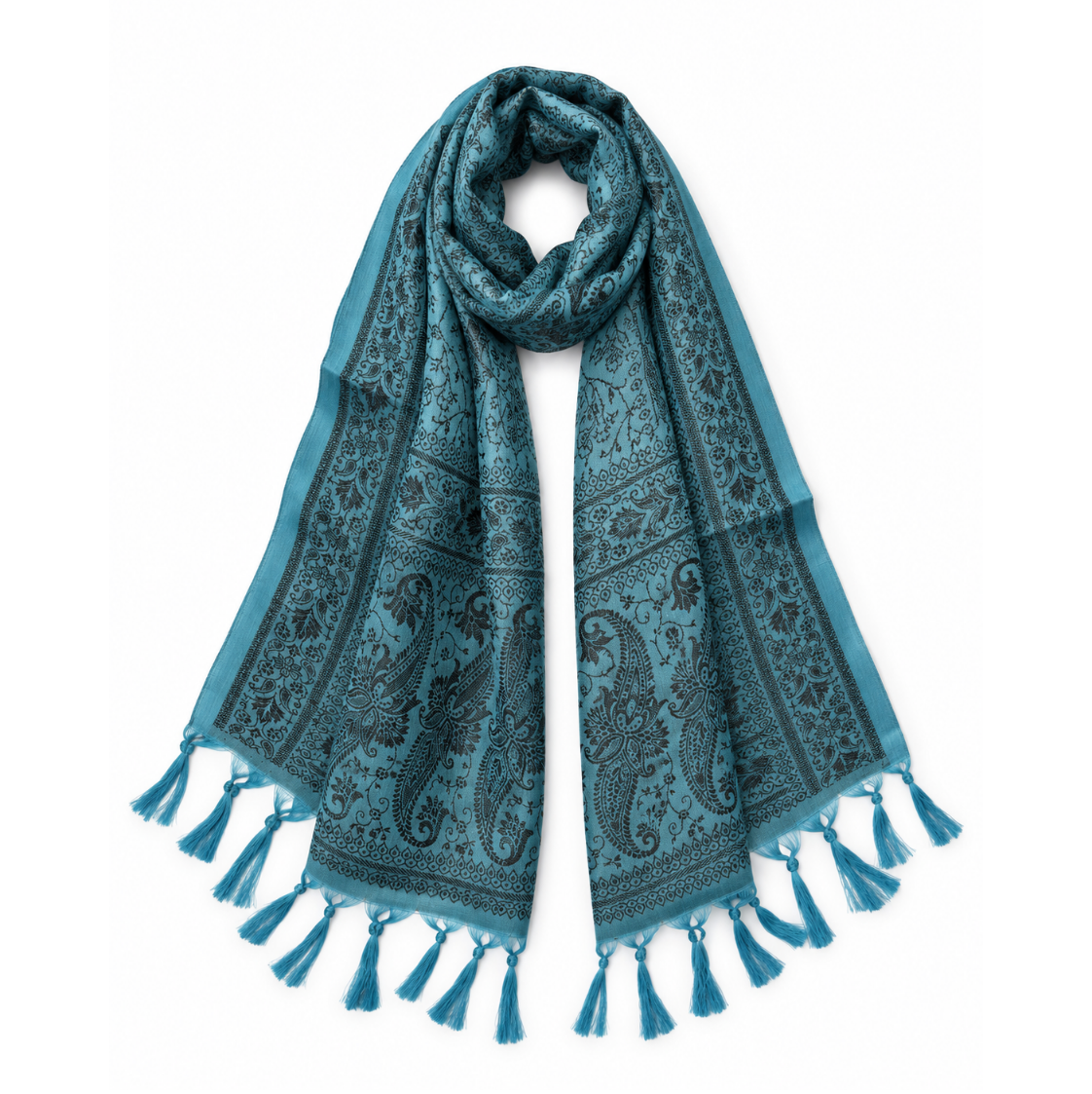 A teal blue scarf with a black paisley and floral pattern, featuring tassel fringe on both ends, displayed against a solid white background.