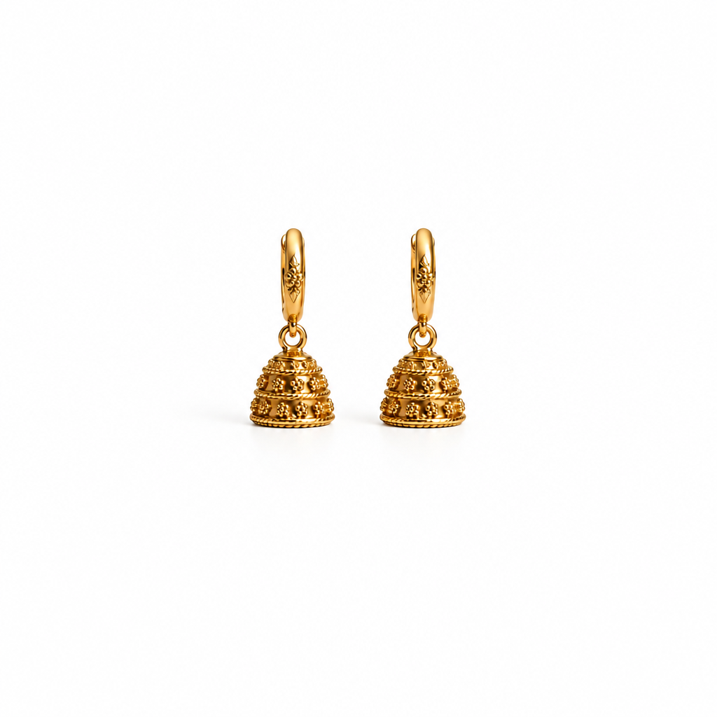 A pair of gold beehive-shaped dangle earrings with textured floral engravings and smooth gold hoops, shown on a clean white background.