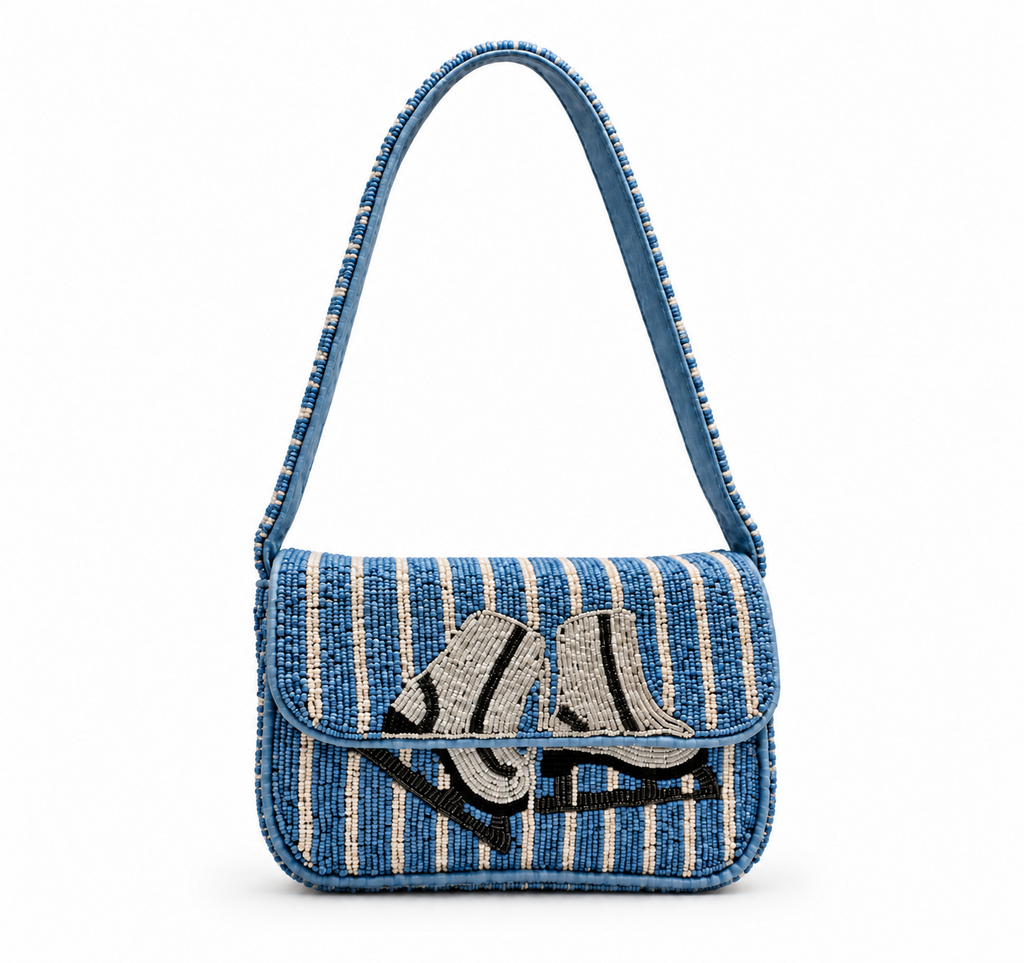 A blue and cream striped woven shoulder bag with a beaded flap featuring a stylized black and white shoe design, shown on a plain white background.