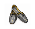 A pair of dark gray leather Juttis with gold-colored decorative stitching on the toes, displayed on a clean white background. The brand label 'KUM' is visible inside the shoes.