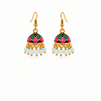 A pair of gold-plated Indian jhumka earrings with vibrant pink, green, and black enamel work, finished with dangling white faceted beads.