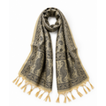 A beige scarf with a black paisley pattern and tassels, draped on a white background.